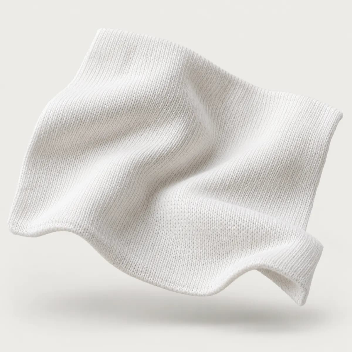 Soft white cotton jersey knit swatch with gentle folds