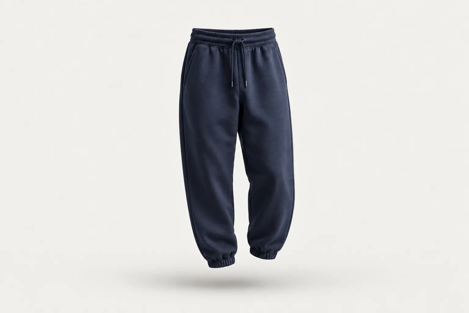 Navy tapered joggers with elastic cuffs and a drawstring waist